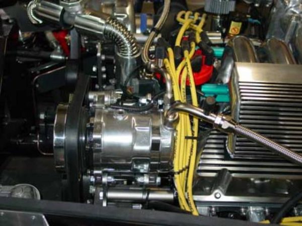 Compressor on one of the available mounting brackets.,  Air Conditioning