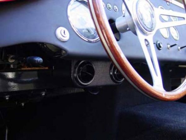 Vents hidden under the dash. Notice the bottom vent that blows air into the footbox.,  Air Conditioning